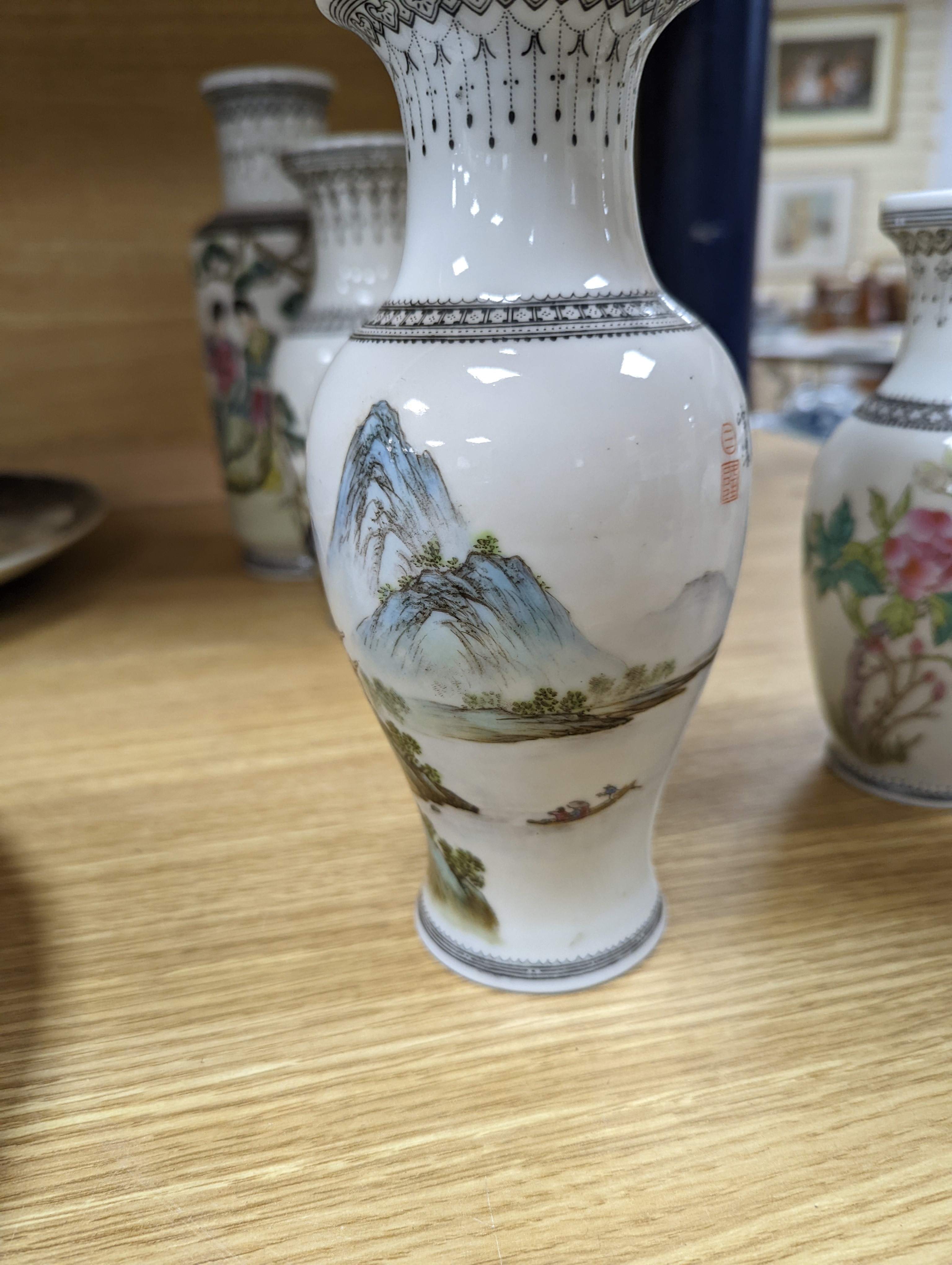 A group of seven Chinese famille rose vases, 20th century